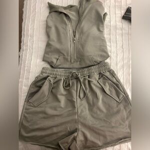 Two-piece outfit. Quarter zip and high rise shorts